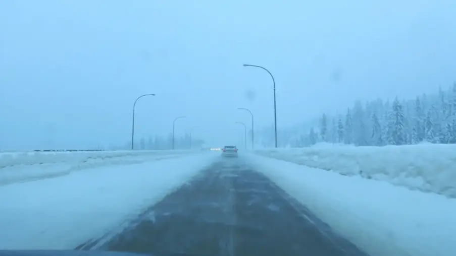 Snow-covered lanes on the Coquihalla Highway in British Columbia in winter