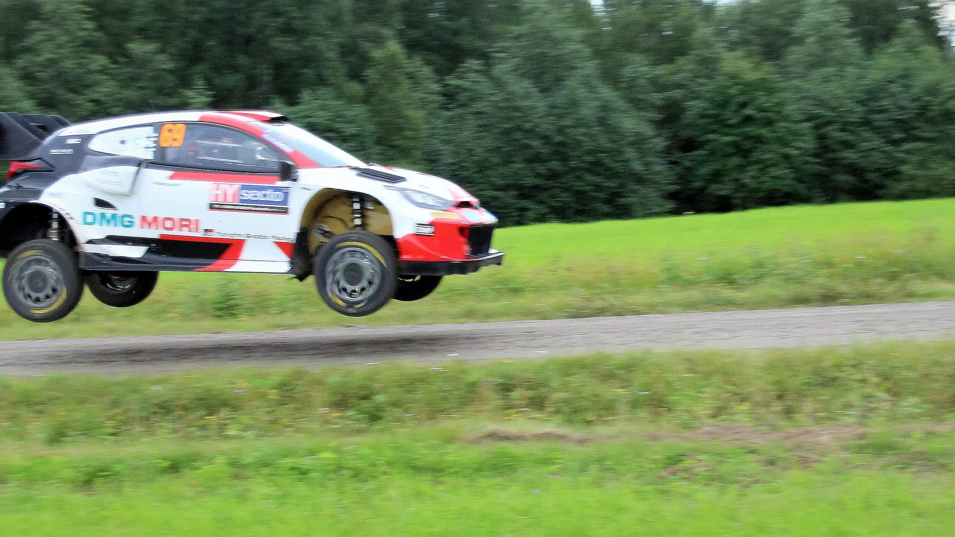 Toyota GR Yaris Rally1 airborne over a crest at Rally Finland 2022