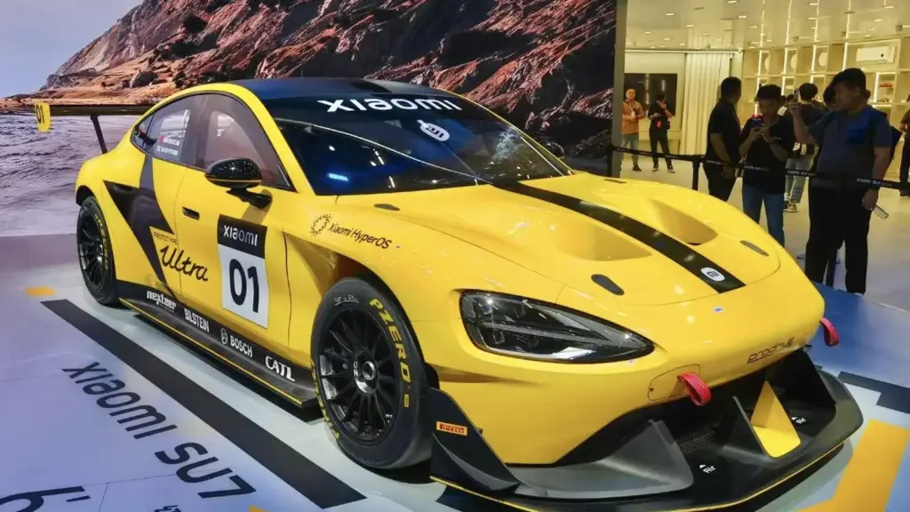 Yellow Xiaomi SU7 Ultra prototype race car on display
